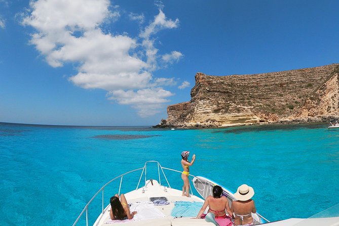 7 hours Boat trip to Lampedusa lunch, SUP and Snorkeling - La Tabaccara, where the water does the talking