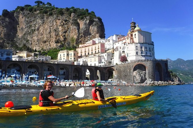 Amalfi Coast Kayak Tour: Explore Caves, Arches & Hidden Beaches - Visiting the Runghetiello Grotto inside a red and green world