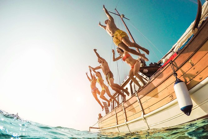 Amalfi Coast & Positano: Boat Tour with Snorkeling & Drinks - Praiano and the Africana Grotto: bright blue water from light and rock