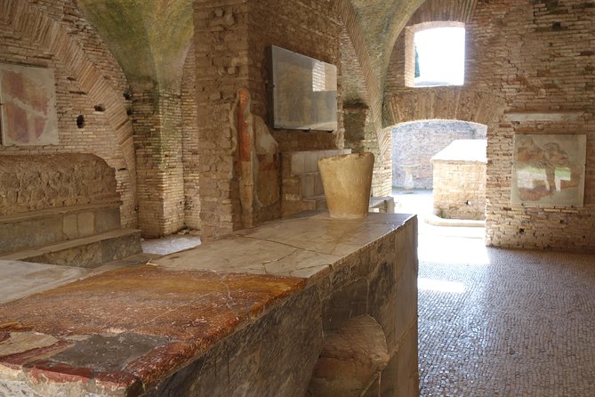Ancient Ostia Antica Semi-Private Day Trip from Rome by Train with Guide - Forum of the Corporations, temples, taverns, and public baths