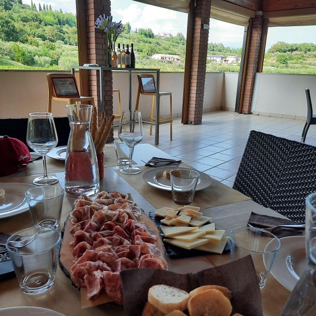 Bardolino: Vineyard Tour with Wine, Olive Oil & Food Tasting - Meet the people and the place: a family winery with a post-war origin story