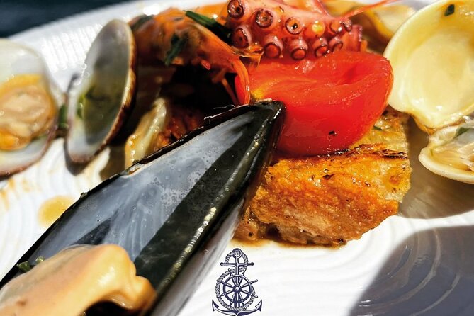 Boat excursion with lunch on board to discover Ischia - Citara Bay: bruschetta, legends, and the Ulysses rock story