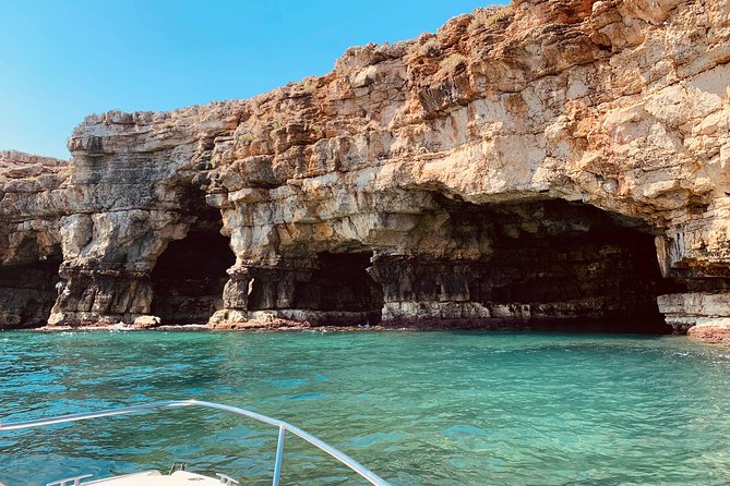 Boat tour of the Polignano a Mare caves with aperitif - Cala Paura and its famous rock writing