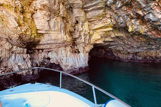 Boat tour of the Polignano a Mare caves with aperitif - Grottone: a cave that once played cinema
