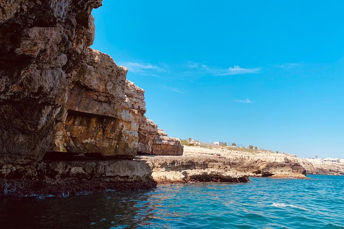 Boat tour of the Polignano a Mare caves with aperitif - Lama Monachile: the postcard beach, seen from the water