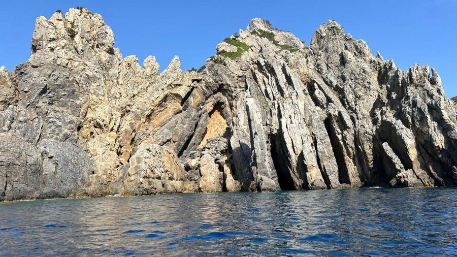 Buggerru: Half-Day Dinghy Tour of the Sardinian South Coast - Snorkeling, fish, and that cave light effect