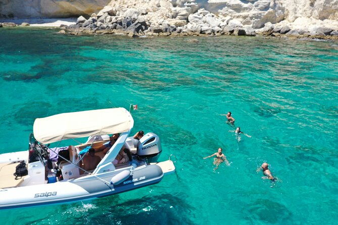 Cagliari Boat Tour 4 Stops .Possible Sighting of Dolphins - What swimming feels like: ladders, time on the water, bring goggles