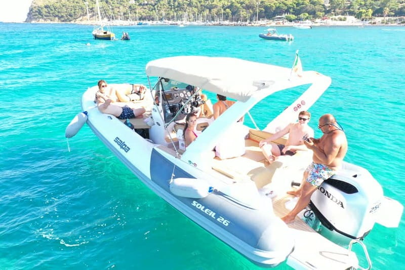 Cagliari: Boat Tour, 4 Stops, Swim, Snorkeling, & 1 Spritz - The onboard vibe: songs, Bluetooth music, and a drink that fits the mood