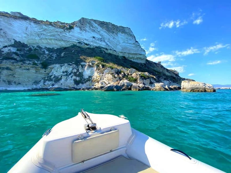 Cagliari: Boat Tour with 4 Swim Stops, Snorkeling & Prosecco - Pass by Grotta dei colombi, then cruise along the coast for photos