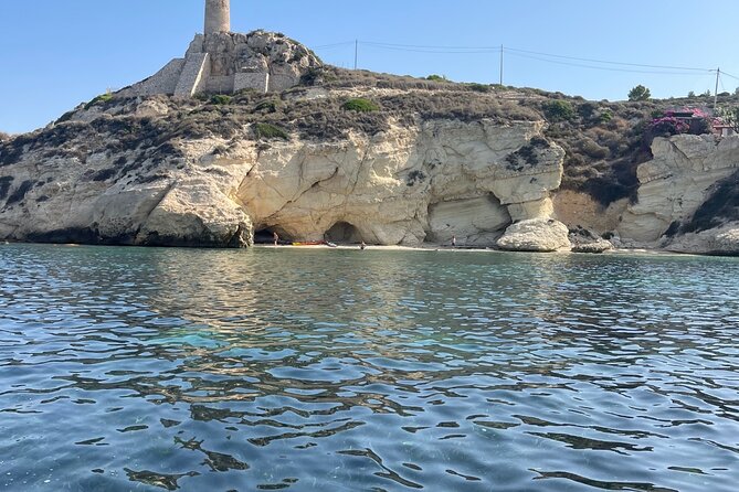 Cagliari Gulf Boat tour : 5 stops, snorkeling & local aperitif - Stop 2: Calamosca Beach, emerald-green water and the Gulf’s tower