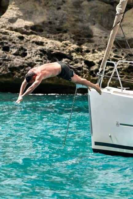 Cagliari: Sailing Tour with 4 Stops, Snorkeling and Prosecco - The crew experience: Alma, Patrick, Laura, and Paolo