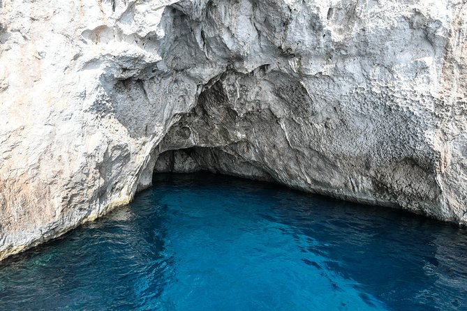 Capri Boat & Land Tour from Sorrento with Limoncello Tasting - The boat loop: grotto stops, Punta Carena, and the Faraglioni from the water