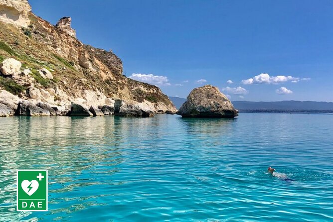 Catamaran tour stops bathing and snorkeling toast with prosecco - Coastline storytelling: Cagliari from the sea, including Capo Sant’Elia