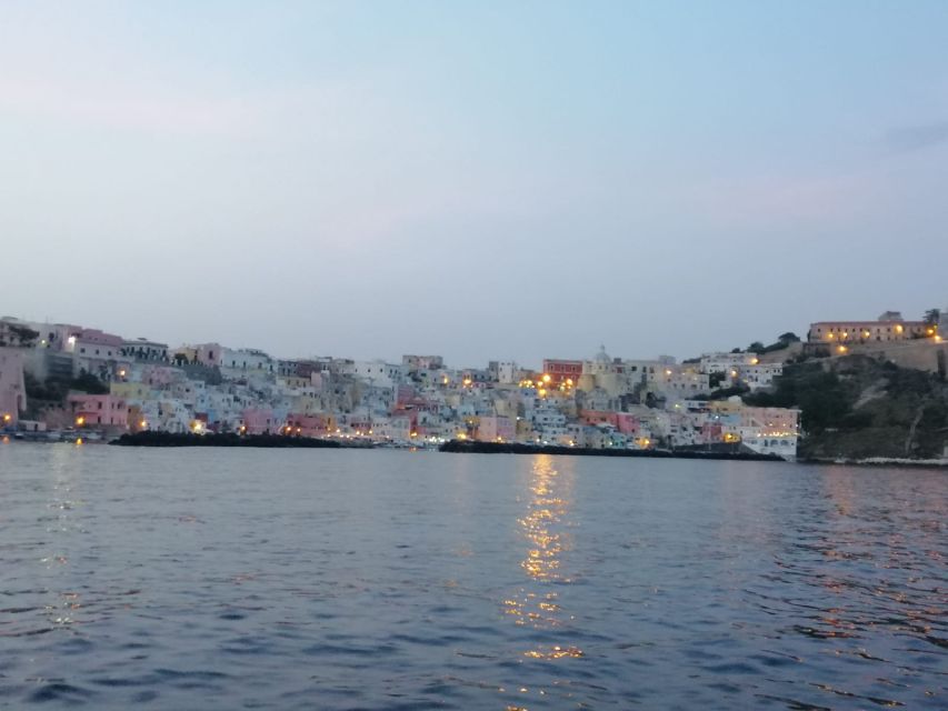 From Ischia: Procida Island Full-Day Boat Tour with Lunch - Ischia coastline views plus your first swim moment
