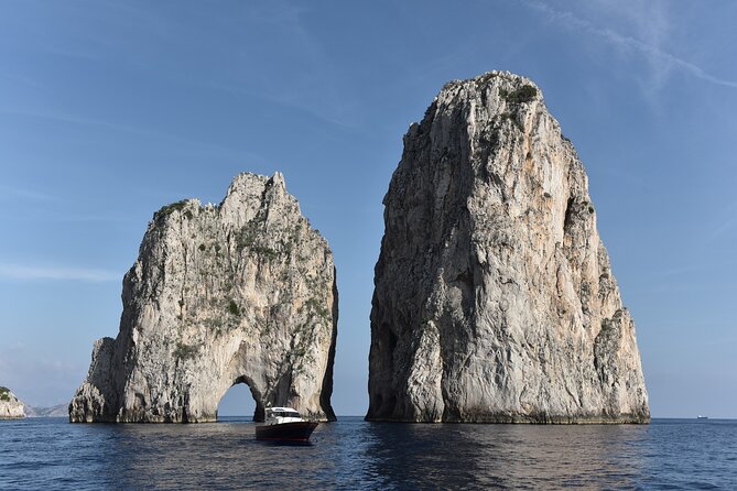 From Sorrento/Nerano:Capri Shared Tour (9:15am Boat Departure) - Capri by boat: grottos, Punta Carena lighthouse, Faraglioni, and a natural arch