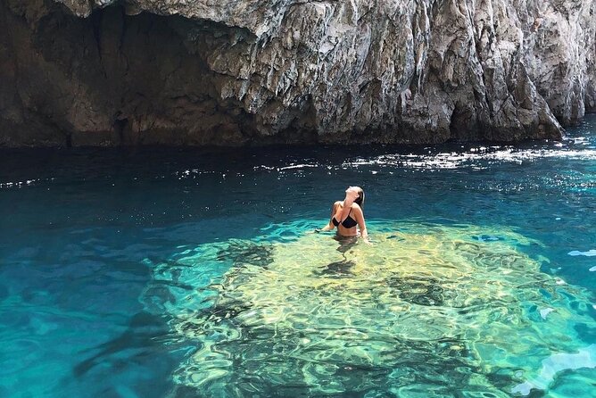 Half day tour of Capri by private boat - I Faraglioni: passing under the arch for the best kind of souvenir photo