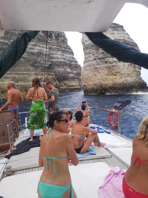 Lampedusa: Yacht excursion, swimming stops and typical lunch - Muro Vecchio on the north coast: sapphire water and cave access