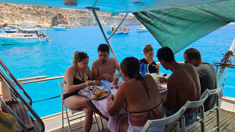 Lampedusa: Yacht excursion, swimming stops and typical lunch - Getting there at Via Alessandro Volta and what the day looks like