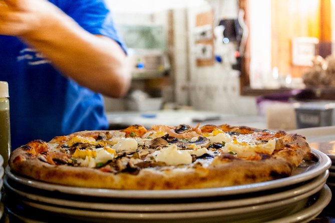 Pizza Cooking Class - The restaurant flow: aprons, table work, and chef attention