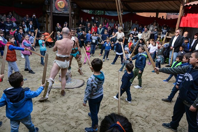 Roman Gladiator School: Learn How to Become a Gladiator - Family Watching From the Platform