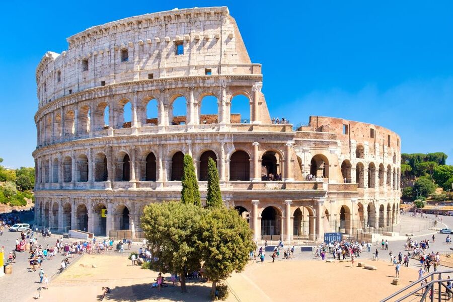 Rome: Colosseum Arena, Roman Forum & Palatine Tour - Entering the Colosseum with skip-the-line help and headsets