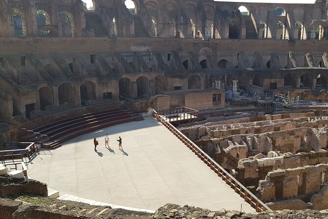 Rome: Colosseum, Palatine Hill and Roman Forum Guided Tour - The Colosseum inside: arena access, terrace views, and the basement-floor story