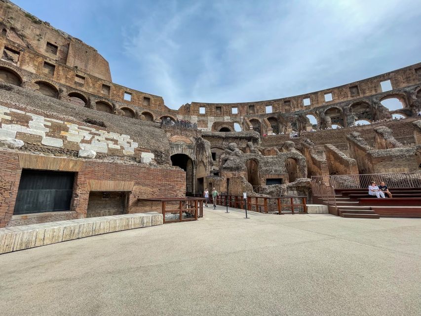 Rome: Colosseum Tour with Access to the Gladiator Arena - The podium moment above the main entrance