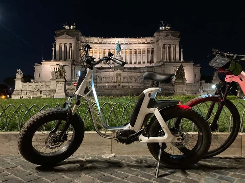 Rome: E-Bike Sunset Tour with Pizza Option - Piazza Venezia, Trevi Fountain, and Piazza di Spagna in warm evening light