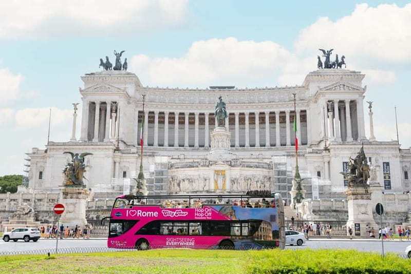 Rome: Hop-on Hop-off Sightseeing Bus Tour with Audioguide - The pink double-decker setup: seats, weather, and real comfort