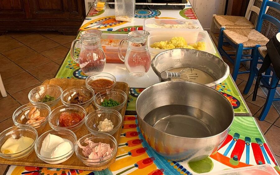 Taormina: Arancino Making Class with Drinks - The patio atmosphere, instructors, and that good kind of chaos