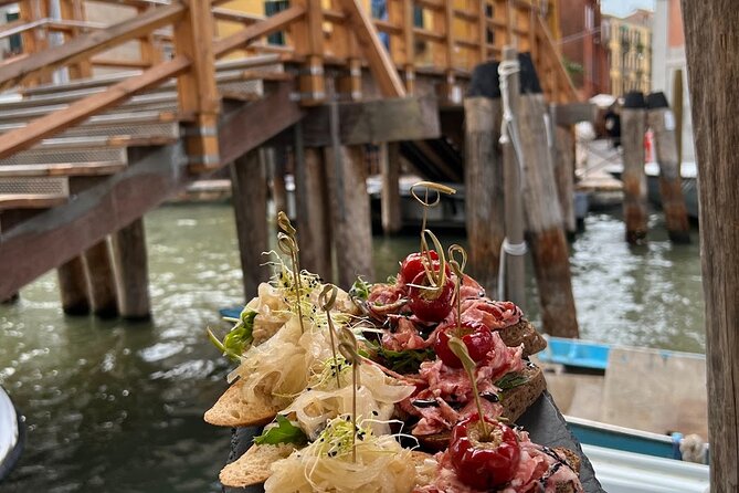 Venice Food Tour with 6+ Tastings with Cicchetti, Spritz & More - The Ex Cinema Teatro Italia stop you can’t believe became a supermarket