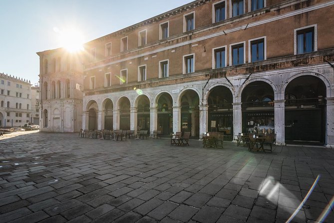 Venice: San Marco to Rialto Walking Tour & Spritz Like a Local - A white plaque, a theatre, and the explorer stop
