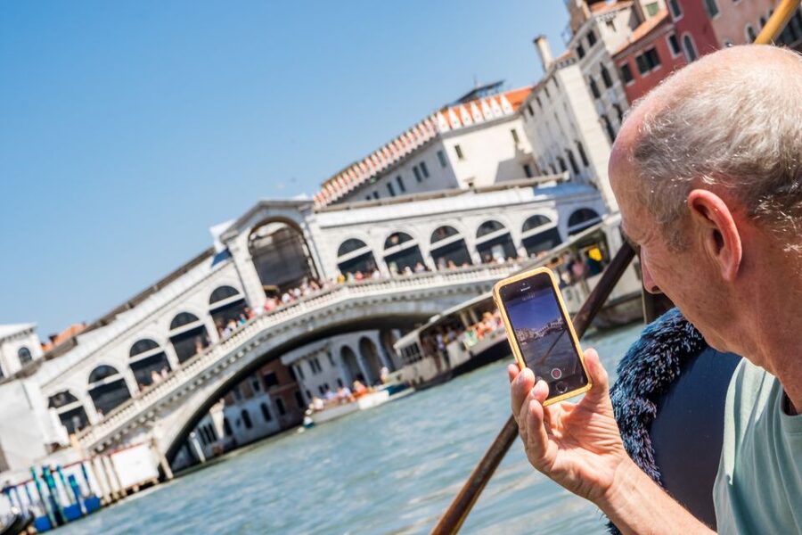 Venice: Shared Gondola Ride Across the Grand Canal - Onboard reality: gondolier style, communication, and seating